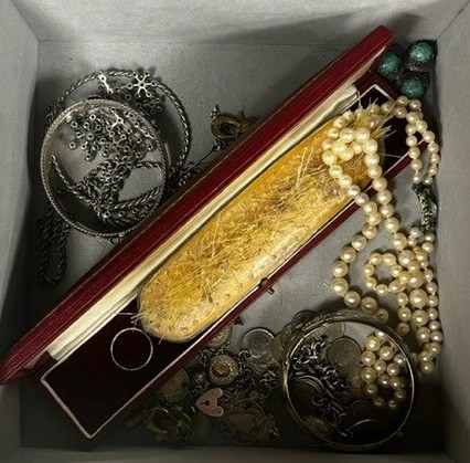 Assorted jewellery, including coin bracelet, two silver bangles, silver medallion and costume jewellery.